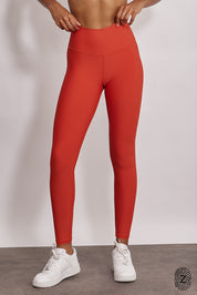 טייץ מבד 4 כיוונים בגזרה גבוהה, ארוך, לוגו touch בחגורת הפריט בחלקה האחורי. גון כתום אדמדם