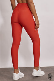 טייץ מבד 4 כיוונים בגזרה גבוהה, ארוך, לוגו touch בחגורת הפריט בחלקה האחורי. גון כתום אדמדם