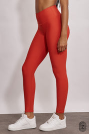 טייץ מבד 4 כיוונים בגזרה גבוהה, ארוך, לוגו touch בחגורת הפריט בחלקה האחורי. גון כתום אדמדם