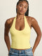 ADEL'S WORLD FABRIC: CLOUD+ MADE FOR EVERYDAY WEAR גופיית קולר מיועדת לאימונים וליום-יום. גב פתוח. הגופייה בשילוב ריפוד נשלף ושכבה פנימית. גוון צהוב.