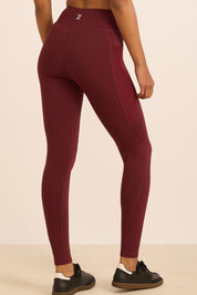 טייץ סקיני ארוך בשילוב חיתוכי לייזר, כיסים צדדים (מרשת) ושרוך פנימי בגוון בורדו