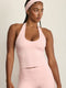 ADEL'S WORLD FABRIC: CLOUD+ MADE FOR EVERYDAY WEAR גופיית קולר מיועדת לאימונים וליום-יום. גב פתוח. הגופייה בשילוב ריפוד נשלף ושכבה פנימית. גוון ורוד.