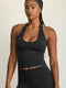 ADEL'S WORLD FABRIC: CLOUD+ MADE FOR EVERYDAY WEAR גופיית קולר מיועדת לאימונים וליום-יום. גב פתוח. הגופייה בשילוב ריפוד נשלף ושכבה פנימית. גוון שחור.