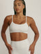 FABRIC: 4 WAY STRETCH FABRIC.טופ מבד 4 כיוונים המתקדם ביותר שלנו, אשר מאופיין באלסטיות ניכרת לאורך כל ארבעת הצירים הראשיים, הבגד עוקב בצורה מושלמת אחר תנועות הגוף ומבטיח חופש פעולה מירבי.גזרה קלאסית קצרה ומחמיאההטופ בשילוב רצועות מתכווננות בגב הטופ.הטופ בשילוב ריפוד נשלף.הדפס ברקע שמנת, דפוס כחול.