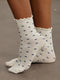 Z SOCKSזוג גרביים בגוון שמנת עם הדפס כחול.מידה: ONE SIZE