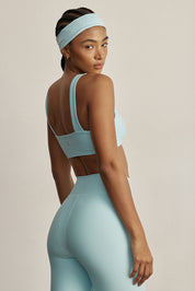 טופ מבד 4 כיוונים מהקולקציה בעיצובה של אדל בספלוב בגוון תכלת ice - הטופ ללא ריפוד נשלף 